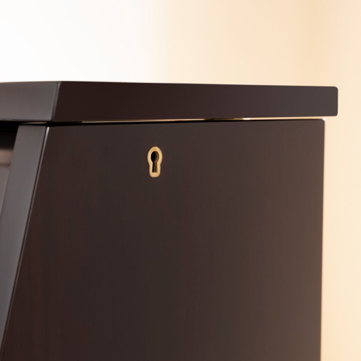 Close-up of ebony Yamaha upright piano lid, highlighting quality craftsmanship and precision finish at Classic Pianos.