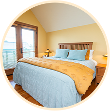 Cozy bedroom with plush bedding, ideal relaxation space after a piano session at Classic Pianos Portland.