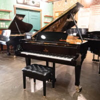 Sauter grand piano with polished ebony finish on showroom floor at Classic Pianos, Portland.