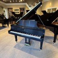 Steinway & Sons grand piano showcasing polished ebony finish and intricate craftsmanship at Classic Pianos Seattle showroom.