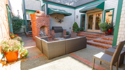 Outdoor seating area at Classic Pianos Portland location entrance, highlighting inviting customer experience.