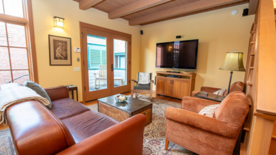 Elegant living room with cozy seating and classic decor, perfect for relaxing after playing a Steinway piano.